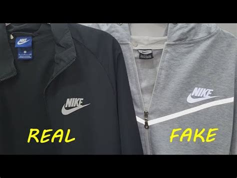 Nike tech track suit real vs fake. How to spot fake Nike zip jacket 